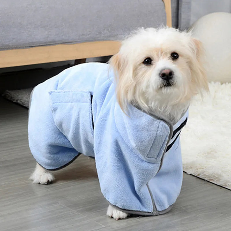 Small dog wearing the Wuffora CozyDry Dog Robe in light blue, indoors